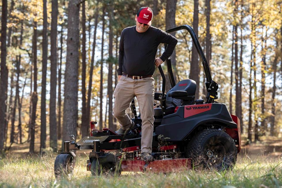 man climbing off of a Yanmar YZ360 Zero-Turn Radius Mower