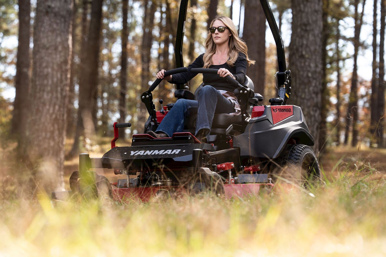 woman mowing in a timber