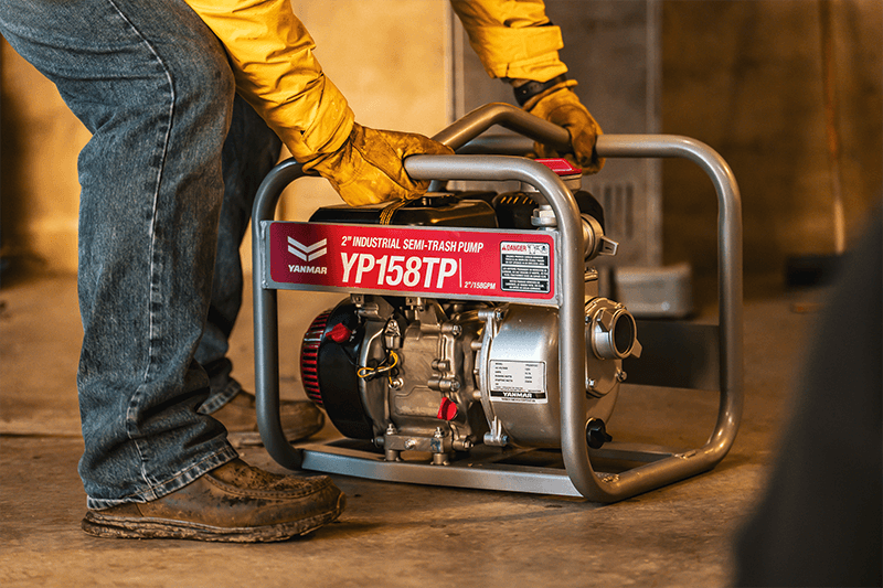 man picking up pump